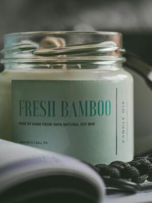Close-up of a soy wax candle labeled Fresh Bamboo, offering a calming home fragrance.